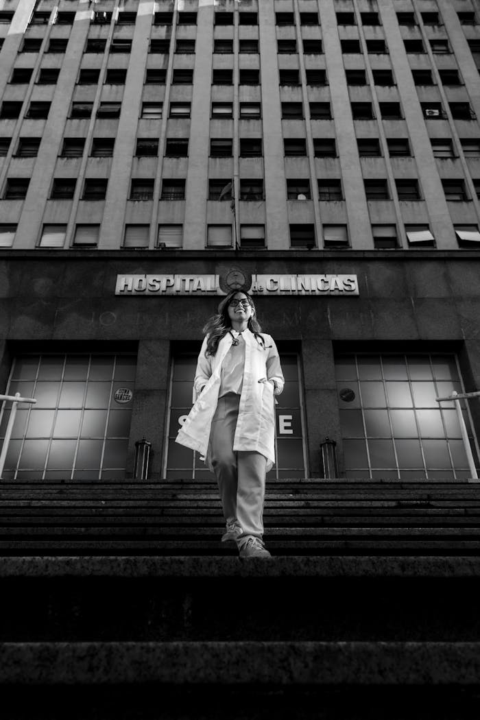 Doctor standing in front of Hospital de Clínicas in Buenos Aires, Argentina.
